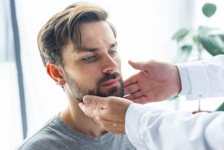 crop-hands-touching-lymph-nodes-patient
